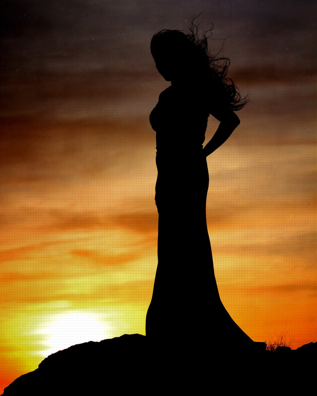 Bobby Narco 'She' a tall and slender Tohono Oodam woman silhouetted in a sunset